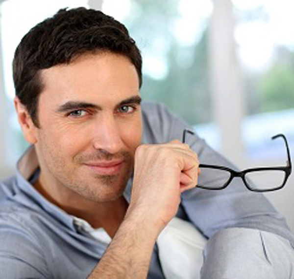 Man with specs smiling